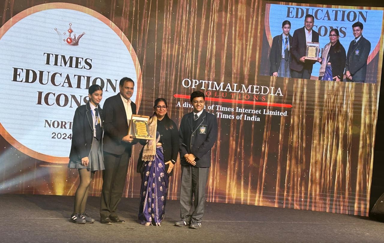 Teacher and students recieving Times Education Icon Awards.