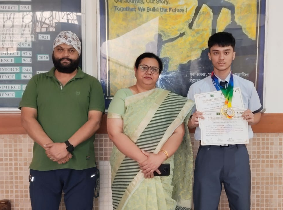 The student proudly representing his certificate of achievement.