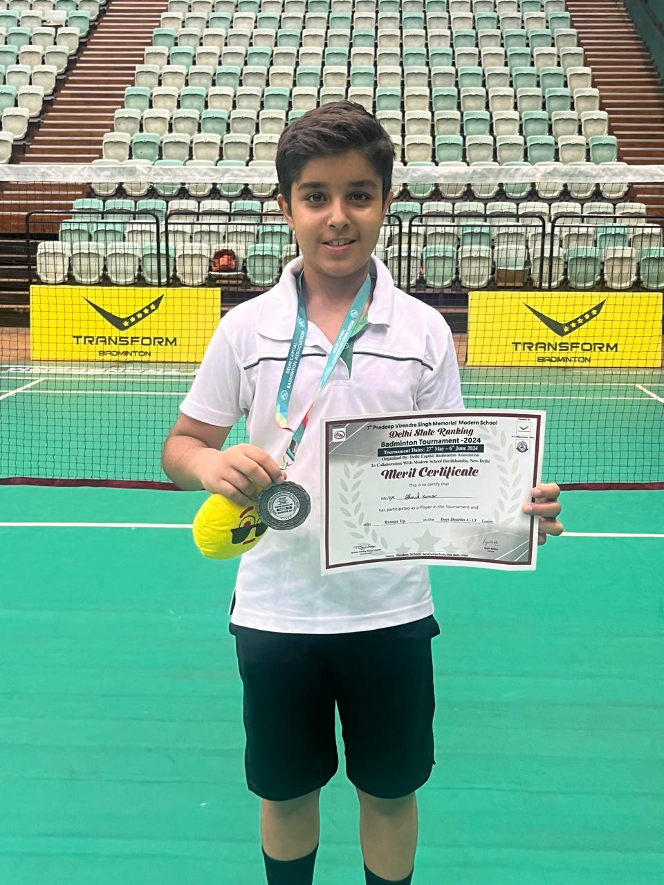 Paricipant with his certificate and medal.