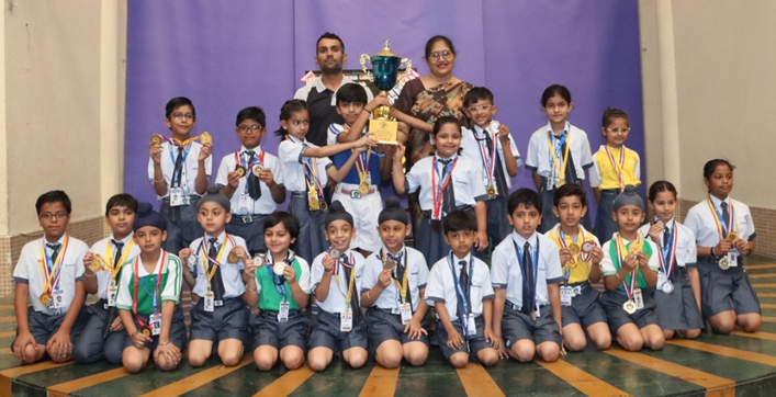 A group photo of teachers and students representing the proud moment of achievment.